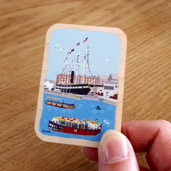 Hand holding Bristol Harbour Wooden Magnet by dona B drawings