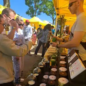 Candle trader with customers - TAP Greenwich Artisanal Marketplace - Old Naval College Grounds