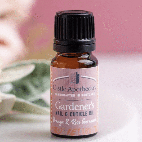 A bottle of orange and rose geranium nail and cuticle oil