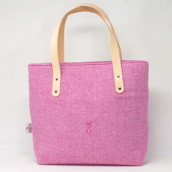 Pink Harris Tweed® cloth tote bag with natural veg tan leather handles, artisan made in the Rhondda Valleys by Emma Easter Handcrafted.
