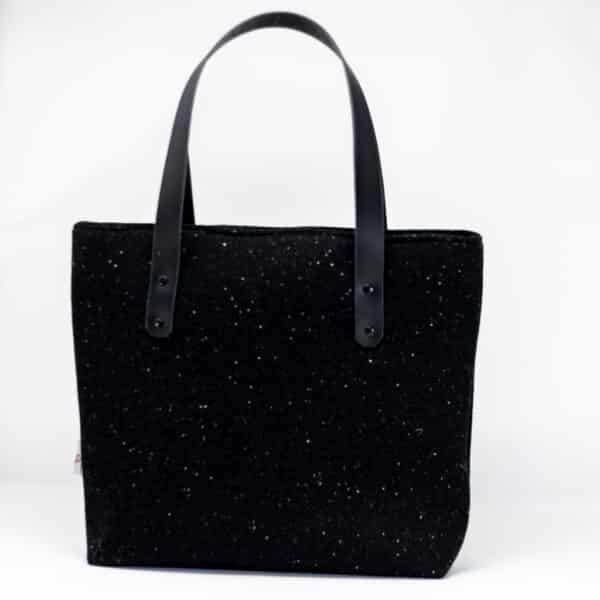 Handcrafted Harris Tweed® cloth tote bag in classic black with leather handles, made in Wales by Emma Easter Handcrafted.