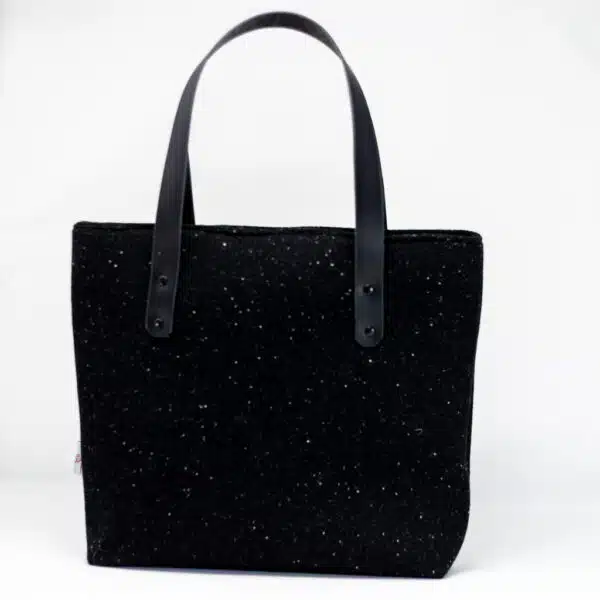 Handcrafted Harris Tweed® cloth tote bag in classic black with leather handles, made in Wales by Emma Easter Handcrafted.