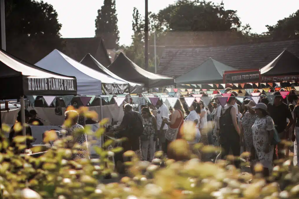 Duck Pond Night Market in Ruislip - customer shopping and bunting