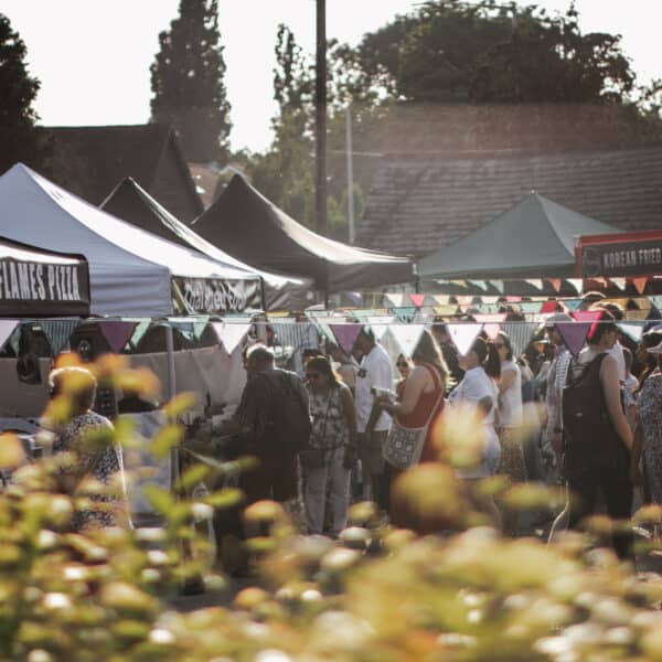 Duck Pond Night Market in Ruislip - customer shopping and bunting