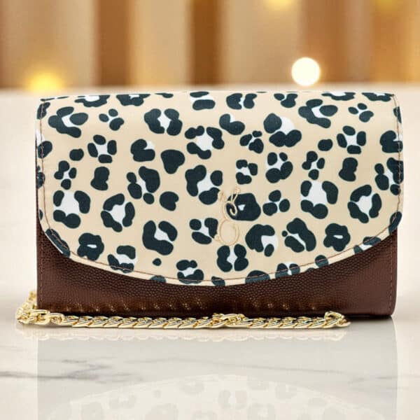 Emma Easter Handcrafted leopard print crossbody clutch with gold chain strap and textured brown leather