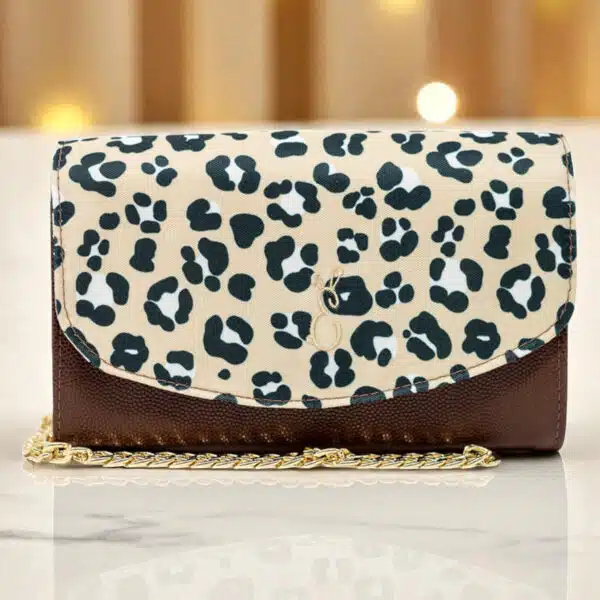 Emma Easter Handcrafted leopard print crossbody clutch with gold chain strap and textured brown leather
