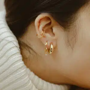 Model with gold earrings