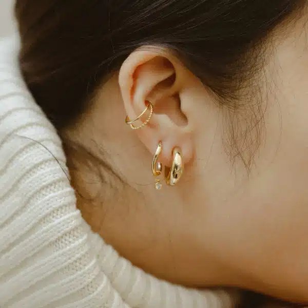 Model with gold earrings