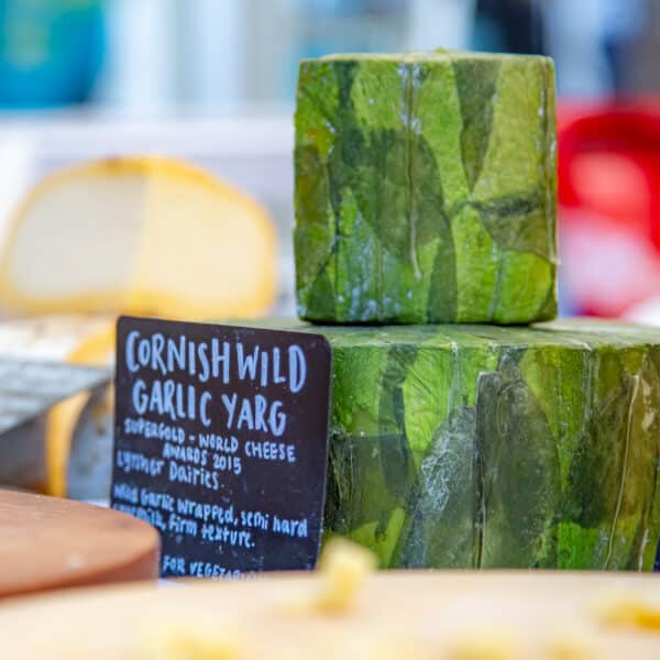 Cornish Wild Garlic Yard Cheese displayed on a market stall