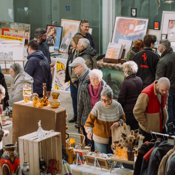 Lots of people shopping for vintage items at a So Retro vintage fair