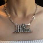 Silver Victorian Greenhouse necklace with my signature halo necklace as a connecting chain. Worn on a model