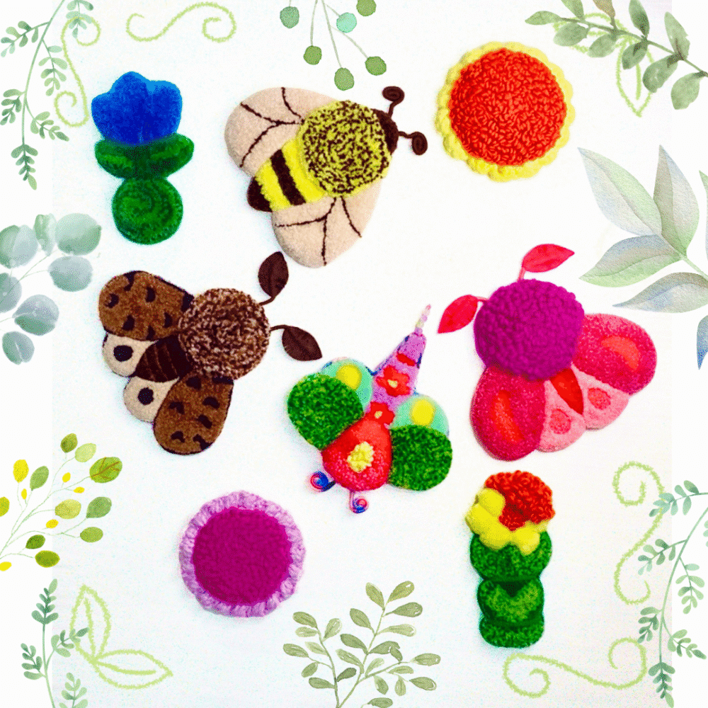 Eight colourful and texturised handmade textile pieces, created using punch needle embroidery and tufting, are arranged on a white background. The collection features three large insects: a fluffy bee in shades of beige, yellow and brown, a dark brown spotted moth, and a butterfly in vibrant pink tones. There are also two small green stems with flowers—a blue tulip and a yellow daffodil, which are flowers commonly found in England—a multicoloured dragonfly shaped like a flower, a round orange flower coaster with a yellow border, and a pink one with lilac borders.