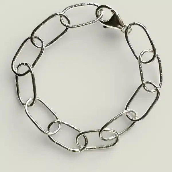 Easy to wear silver links with a hammer finish to catch the light. By Quite Contrary Jewellery
