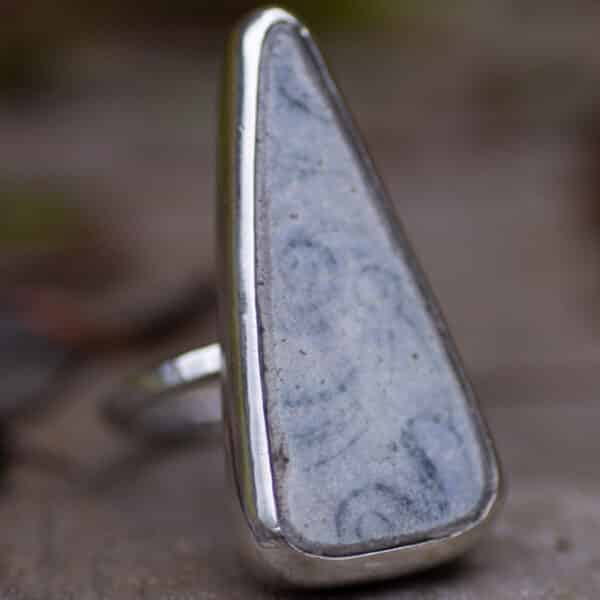 Floral pottery ring, made from a large triangle shaped pottery found along the Fife coast. Wrapped in silver with a textured band. Ebb & Evergreen