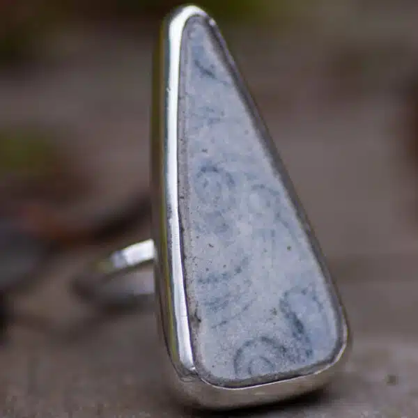 Floral pottery ring, made from a large triangle shaped pottery found along the Fife coast. Wrapped in silver with a textured band. Ebb & Evergreen