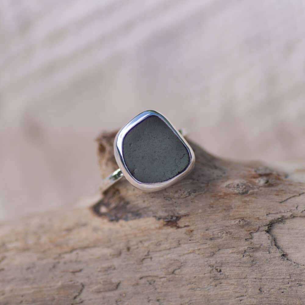 Grey sea glass sterling silver ring, textured band.