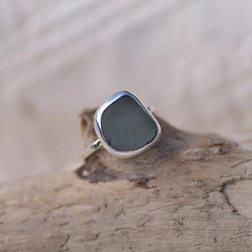 Grey sea glass sterling silver ring, textured band.