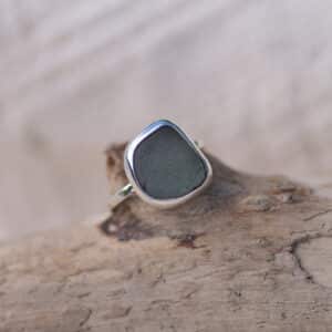 Grey sea glass sterling silver ring, textured band.