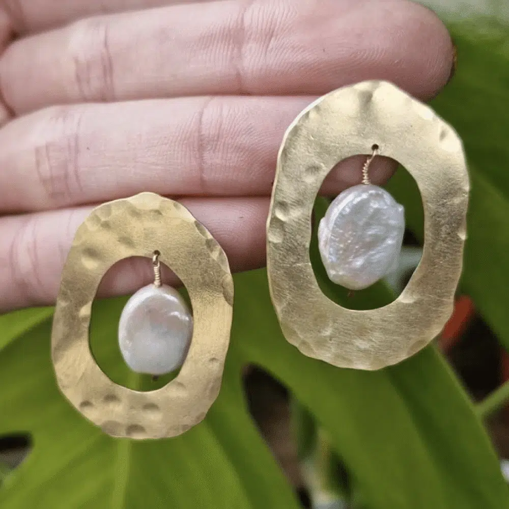 Large oval brass earrings with cut out centre with pearl detail