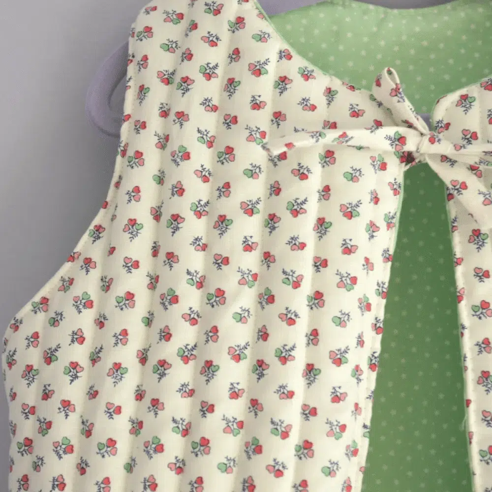 Girls gilet handmade using cream fabric with delicate pink flower print