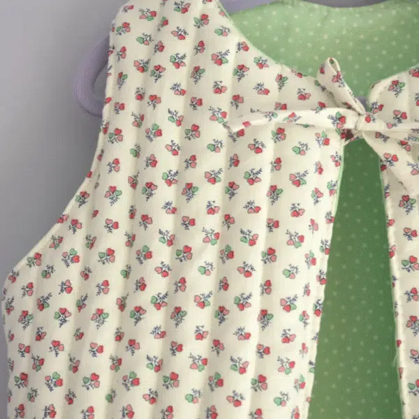 Girls gilet handmade using cream fabric with delicate pink flower print